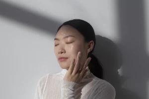 beautiful-asian-woman-posing-with-facial-cream